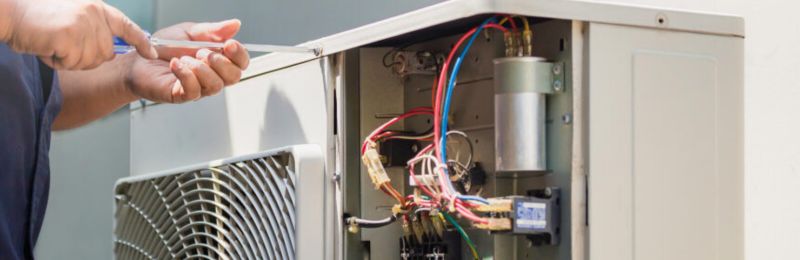 Furnace technician repairing a heating system in Bonita CA